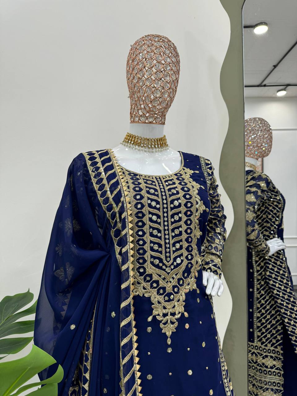 Three-piece ensemble featuring a faux georgette top pent with dupatta