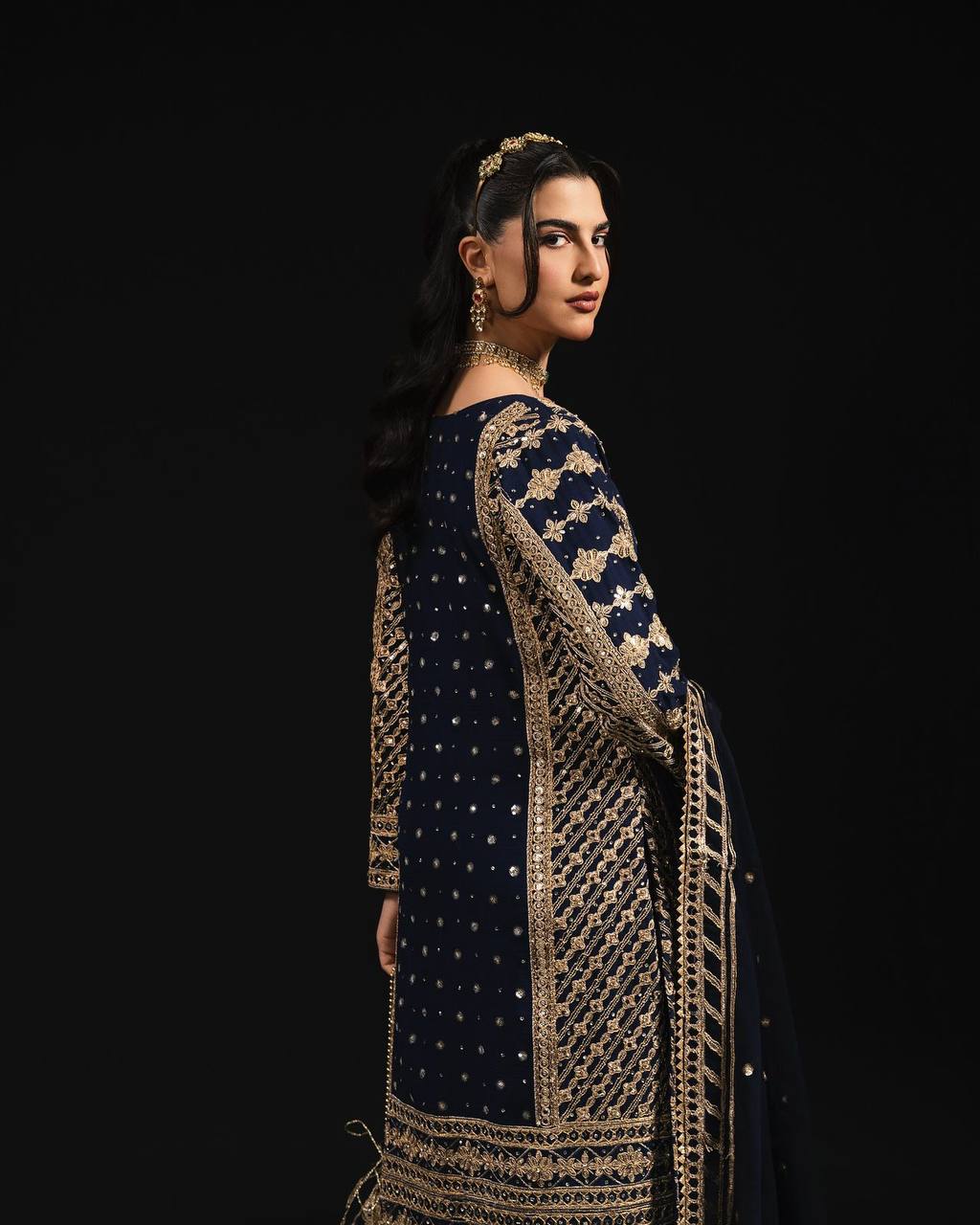 Three-piece ensemble featuring a faux georgette top pent with dupatta