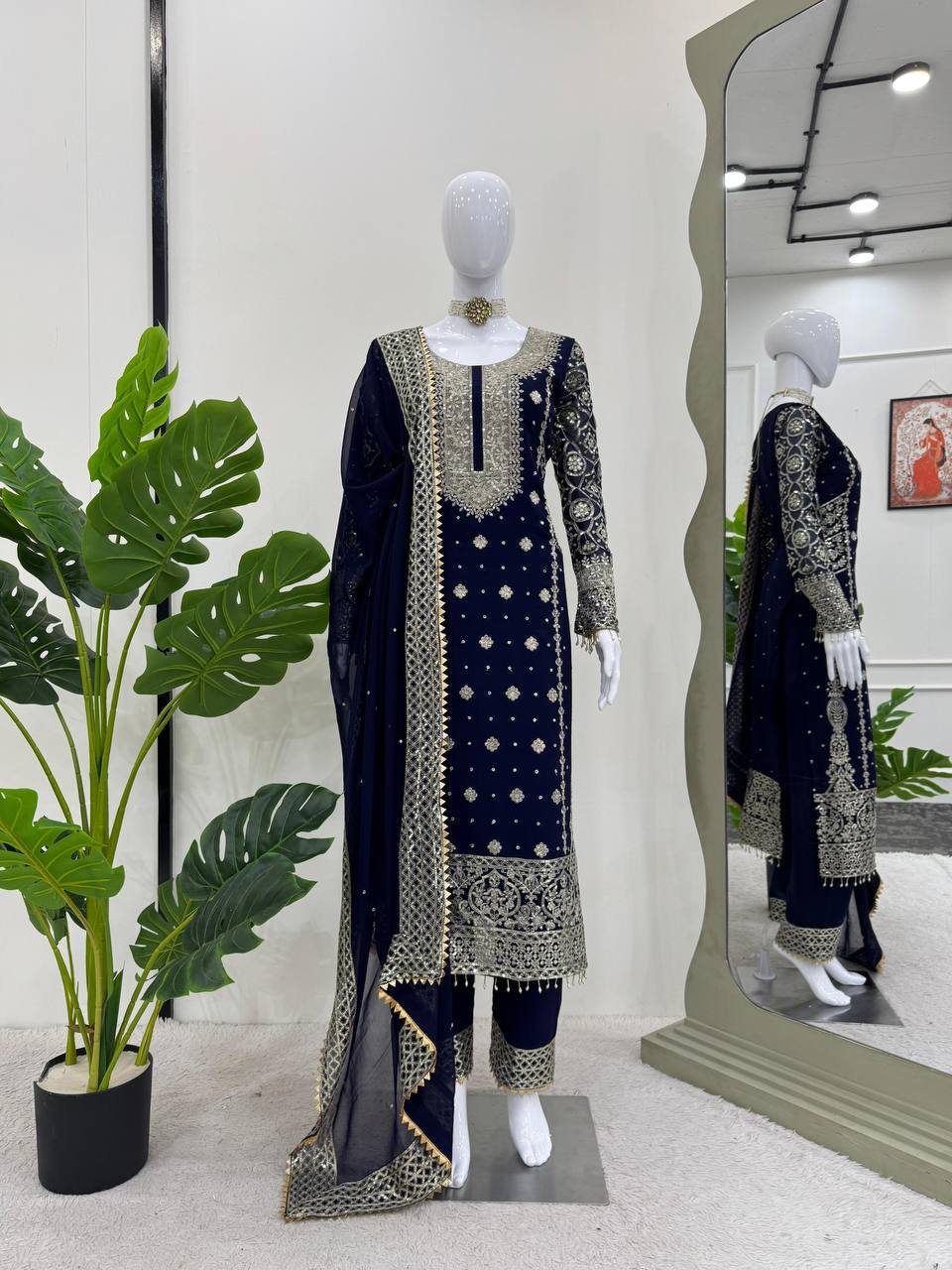 Three-piece ensemble featuring a faux georgette top pent with dupatta