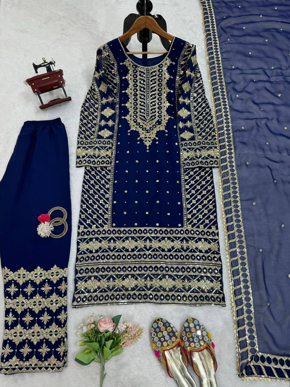 Three-piece ensemble featuring a faux georgette top pent with dupatta