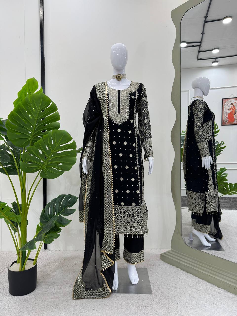 Three-piece ensemble featuring a faux georgette top pent with dupatta
