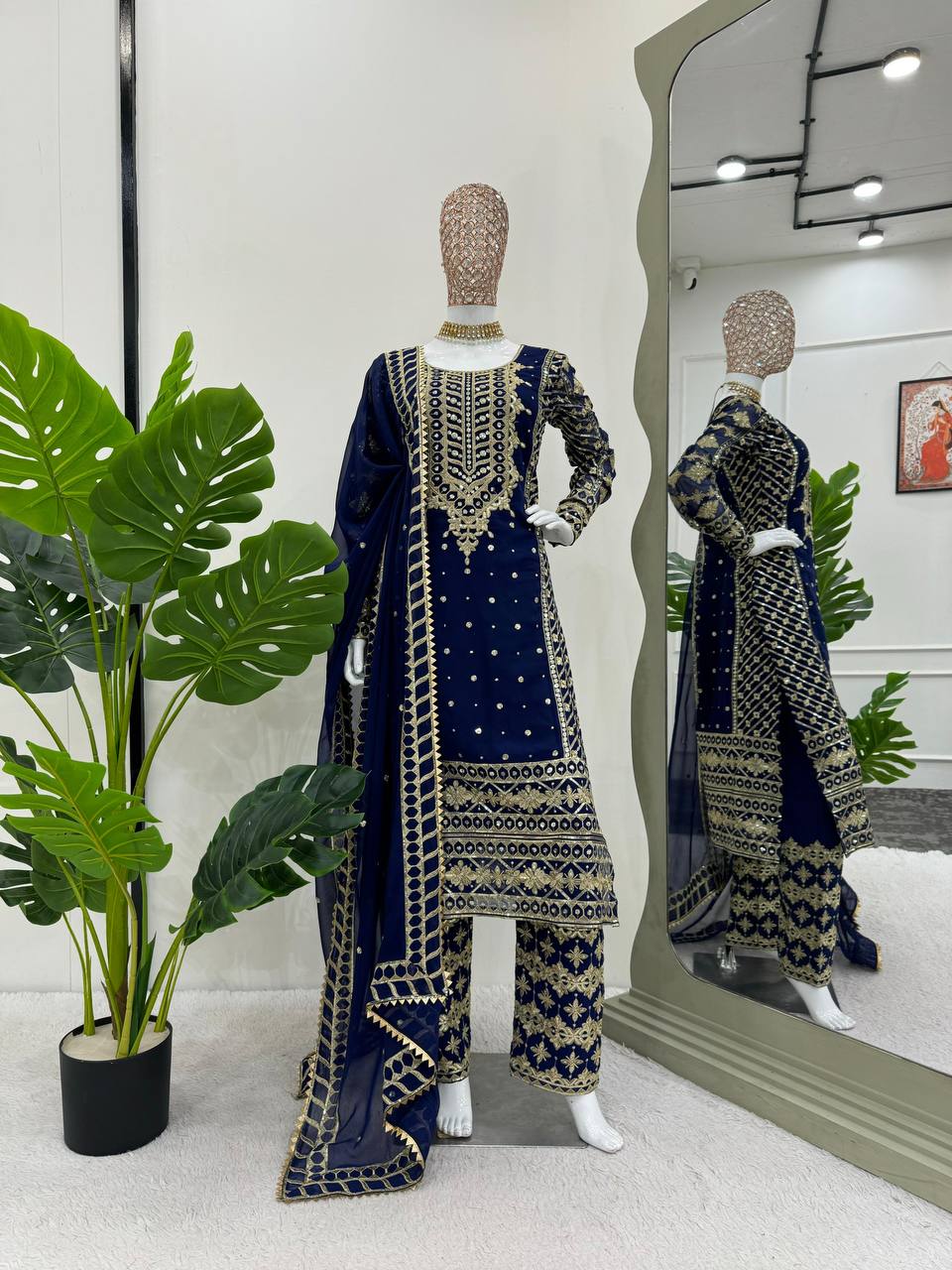 Three-piece ensemble featuring a faux georgette top pent with dupatta