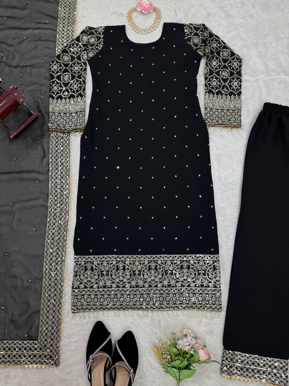 Three-piece ensemble featuring a faux georgette top pent with dupatta