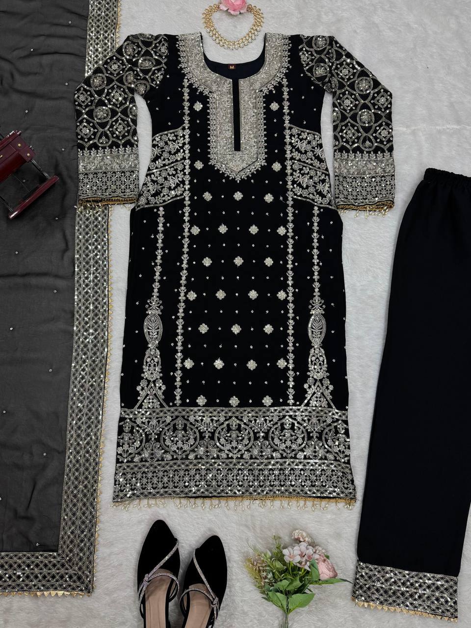 Three-piece ensemble featuring a faux georgette top pent with dupatta
