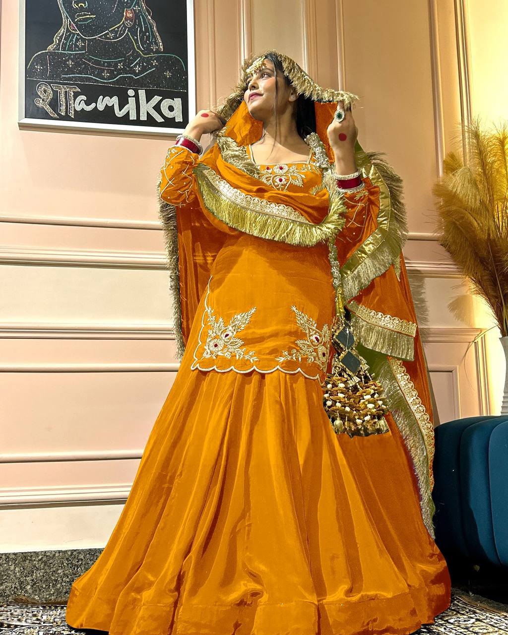 Three-piece  full-sleeve top, lehenga, and dupatta